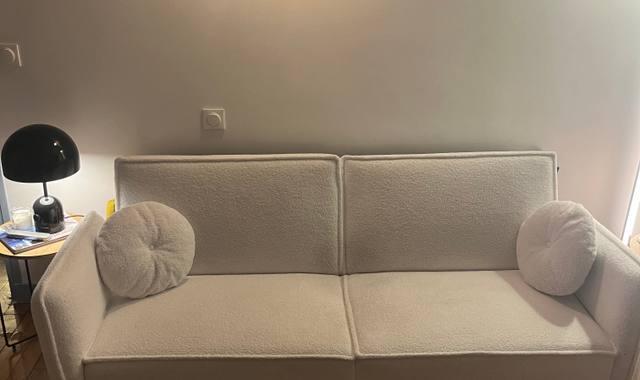 Meubles un canapé trois places convertible blanc
