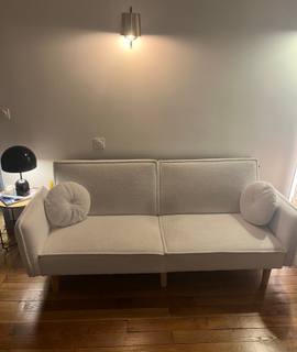 Meubles un canapé trois places convertible blanc